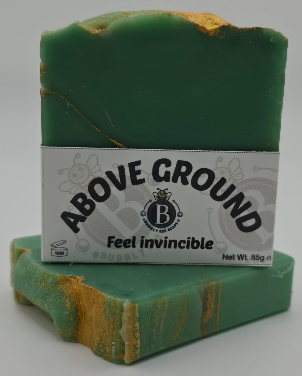 Green soap bar with 'Above Ground' label on a white background