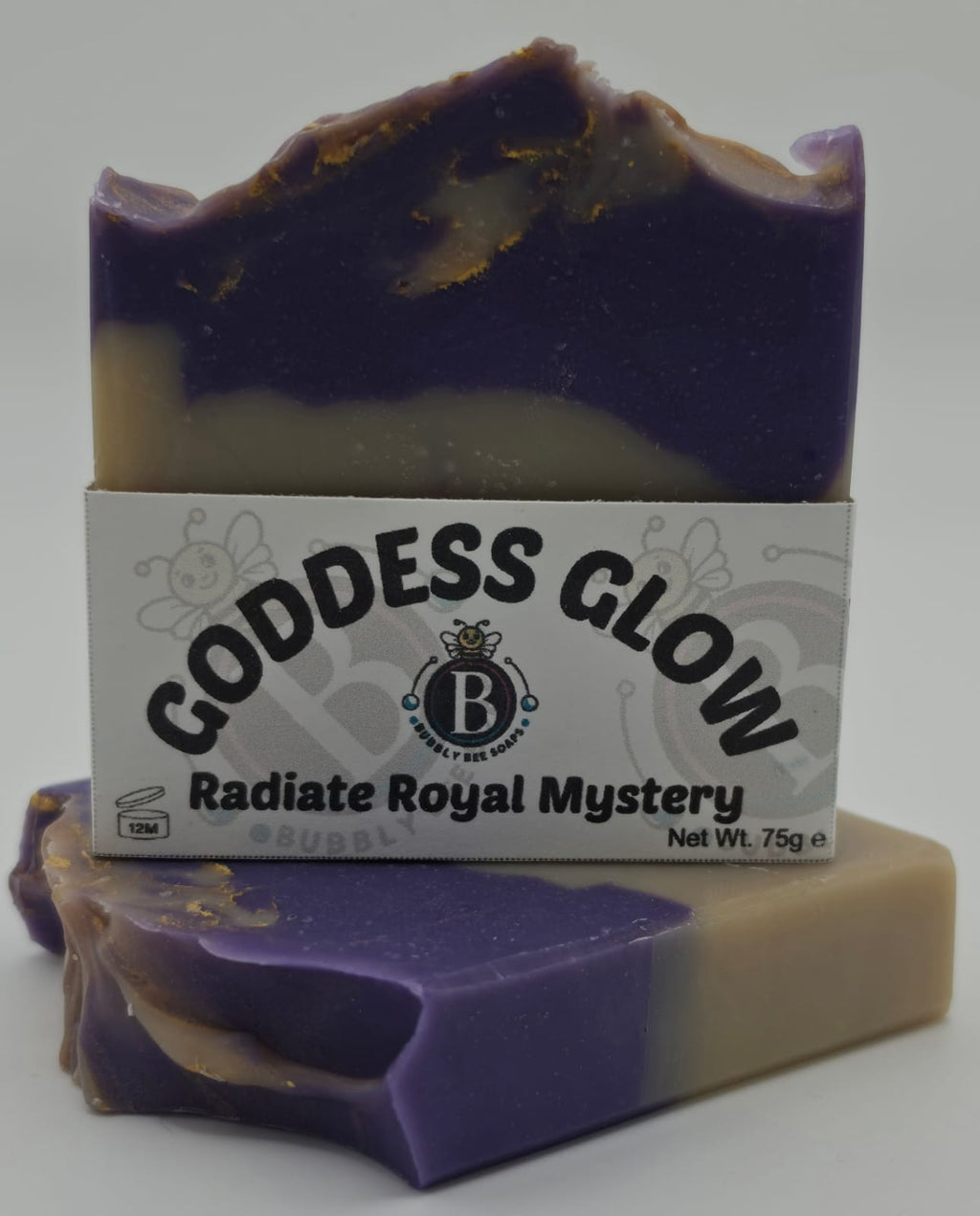Bar of soap with a label reading 'Goddess Glow' on a white background