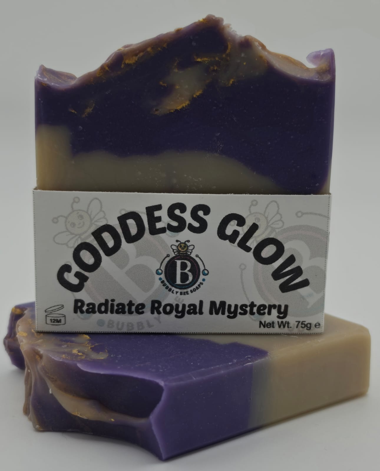 Bar of soap with a label reading 'Goddess Glow' on a white background